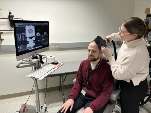 Matthew Slayton receives TMS in his lab.